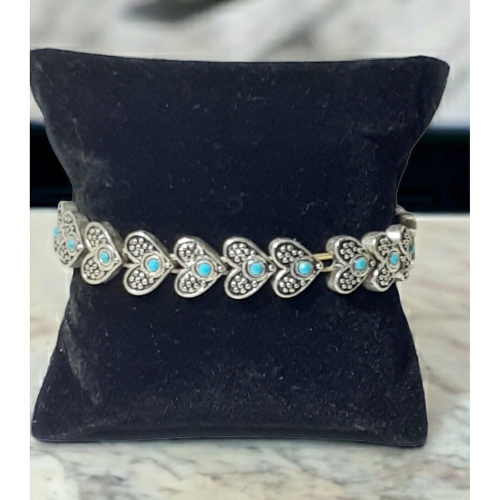 Stretch Bracelet Metal Textured Hearts each with Little Blue Bead